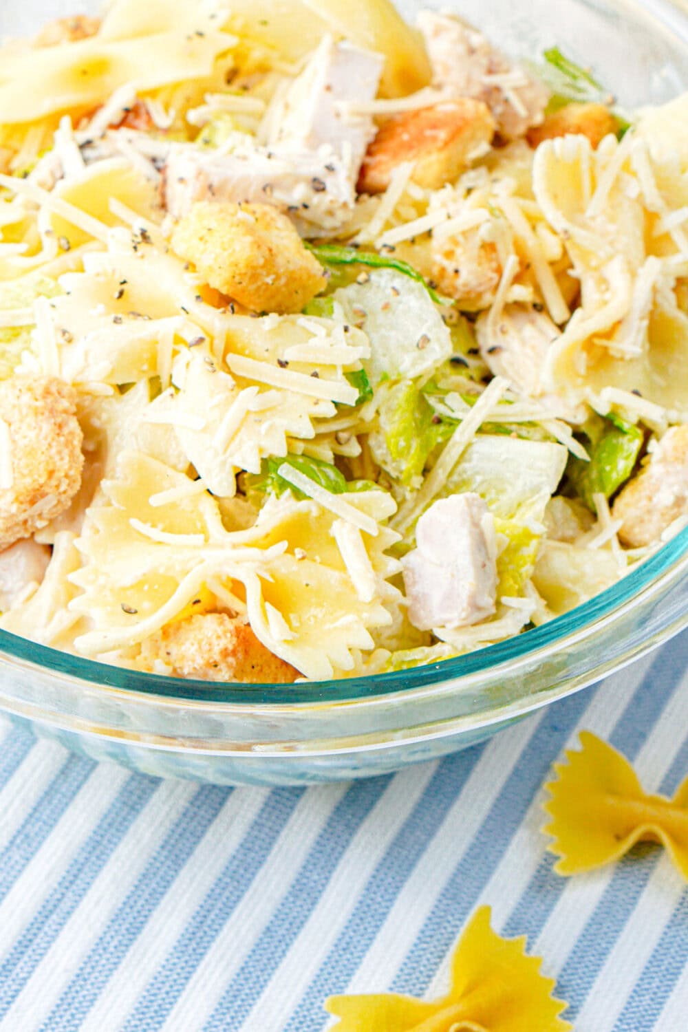 chicken caesar bowtie pasta salad in a bowl