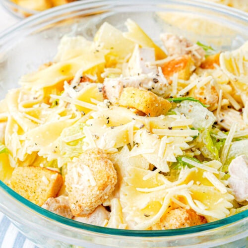 chicken caesar pasta salad in a big clear bowl