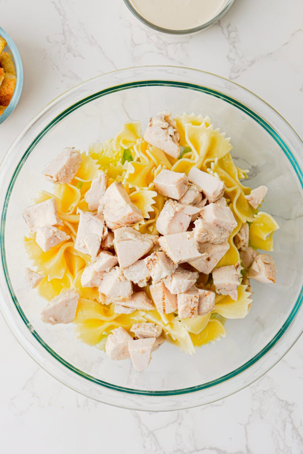 chicken in a bowl with bowtie pasta