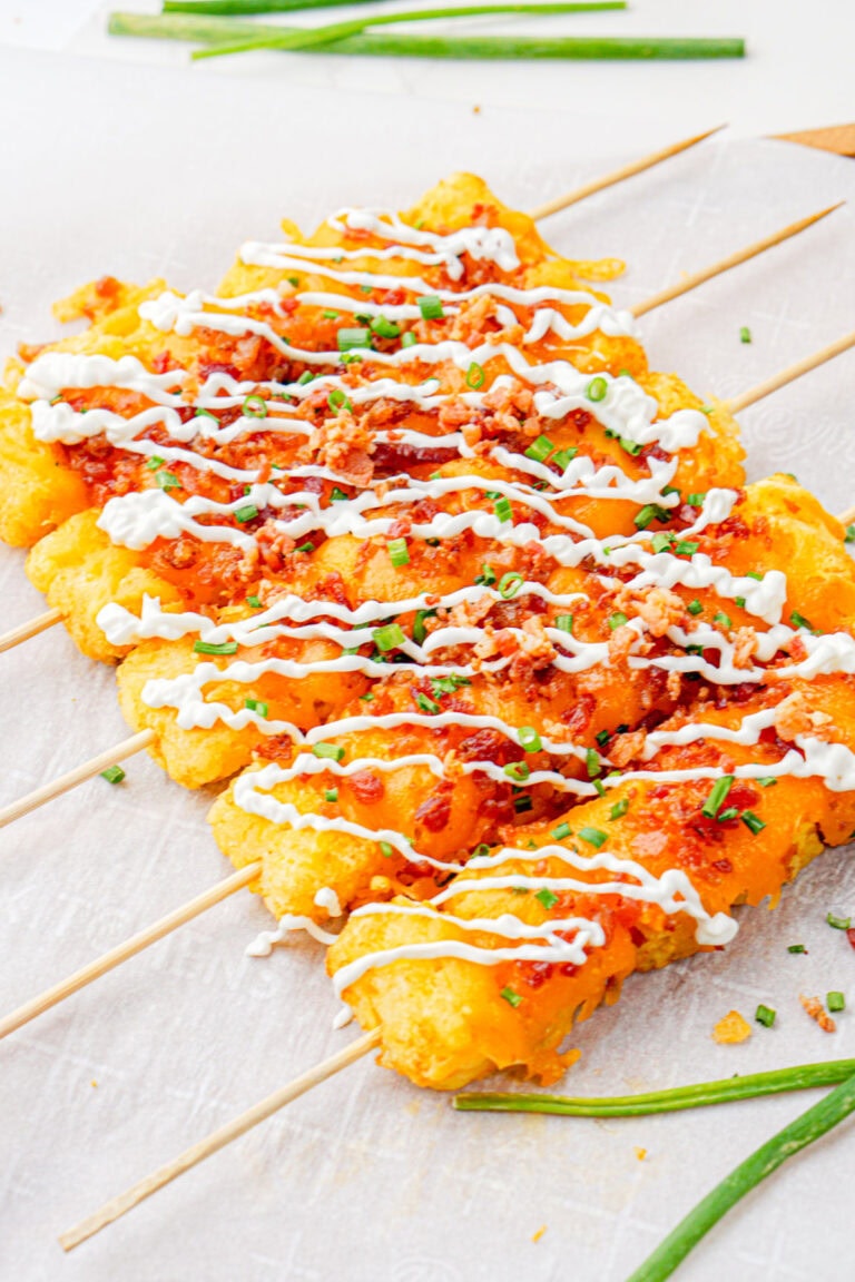 Row of loaded tater tot skewers