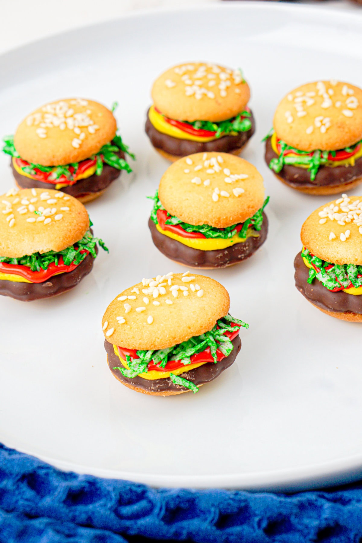 mini cookies that look like burgers on a plate