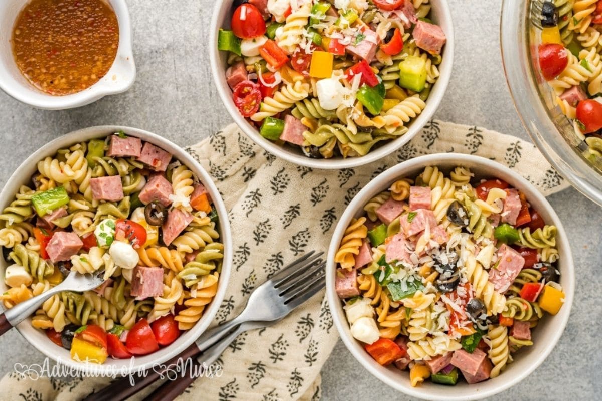 three bowls of pasta salad