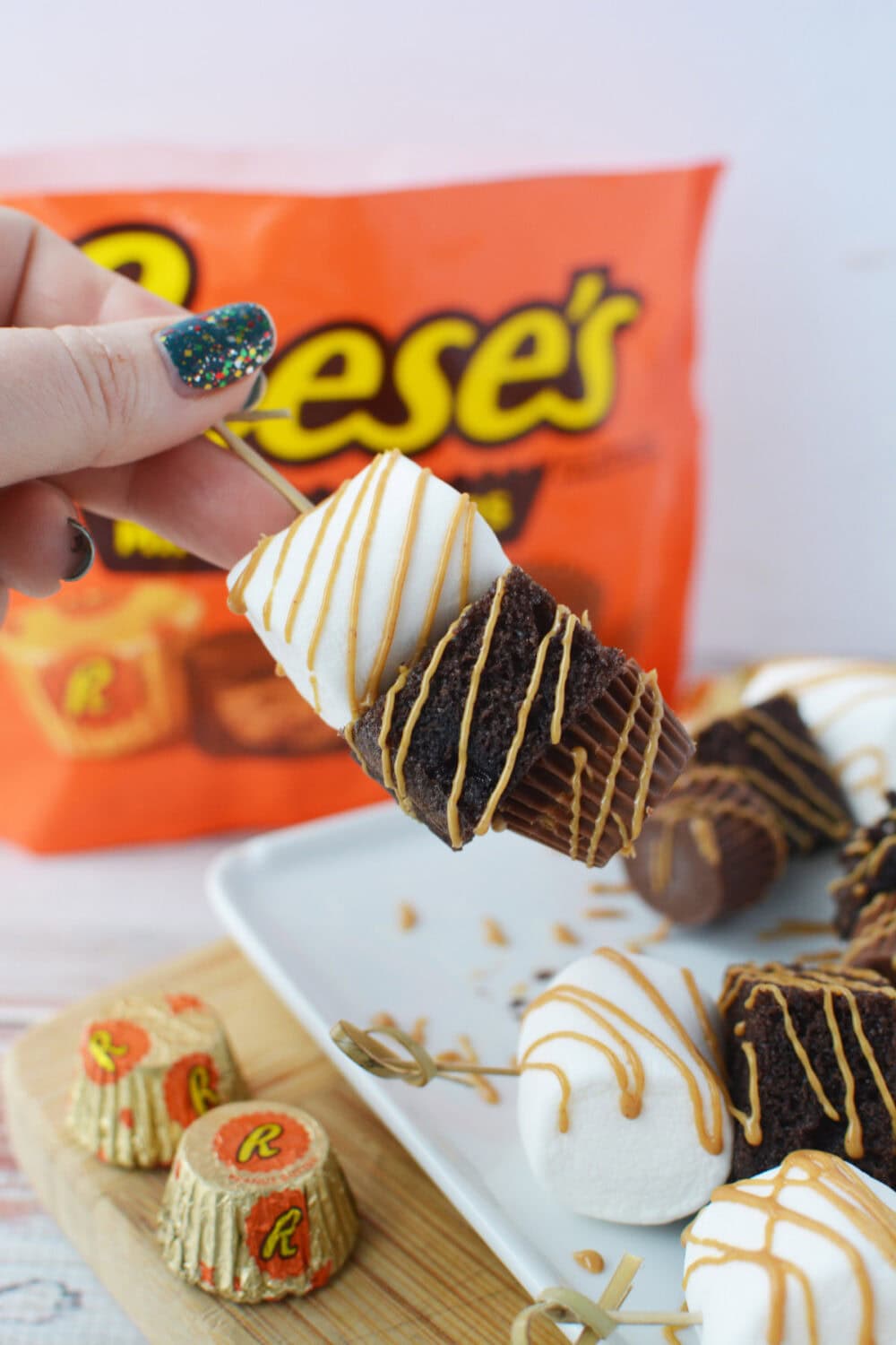 holding a peanut butter cup kabob