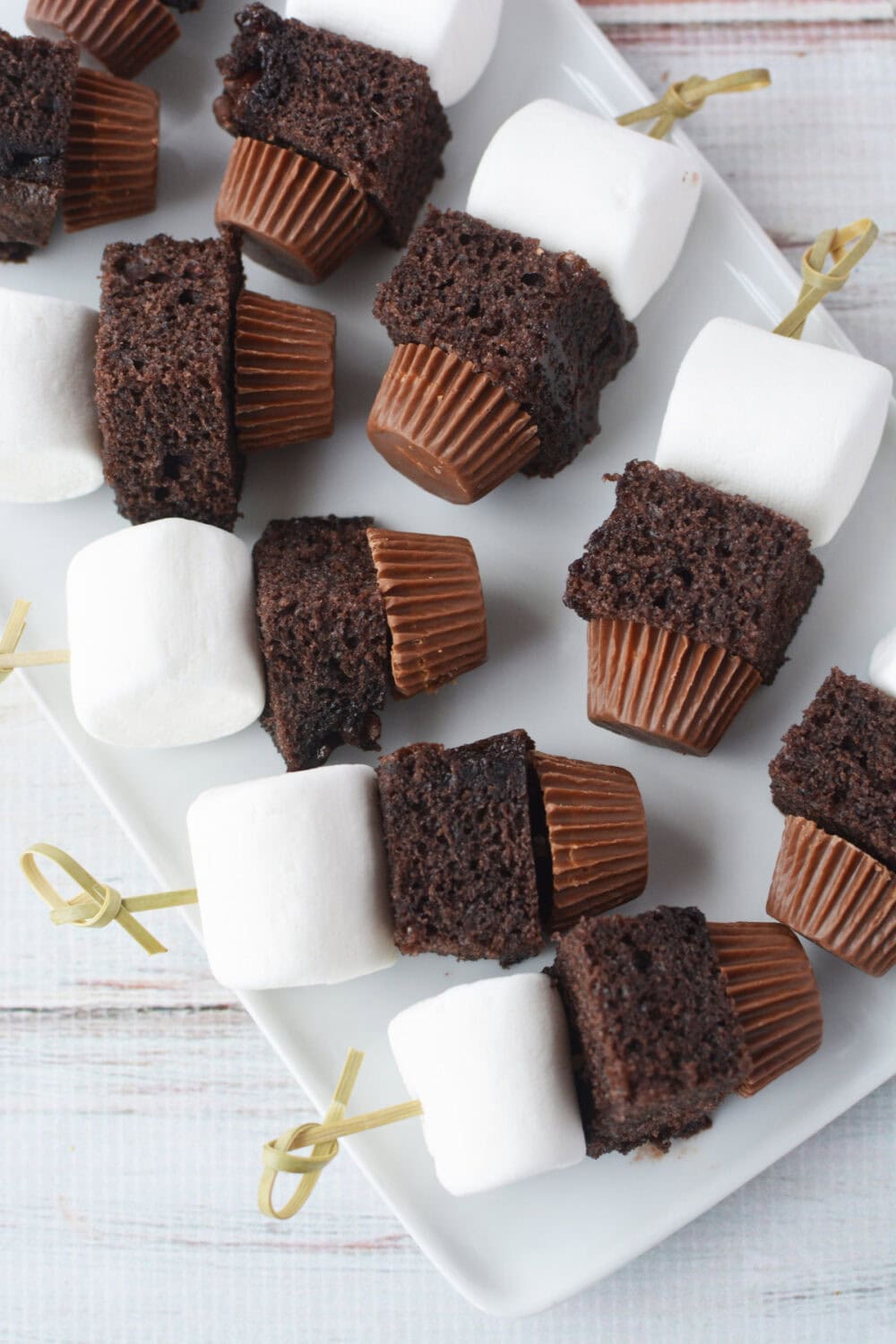 marshmallows, cake, and pb cups on skewers