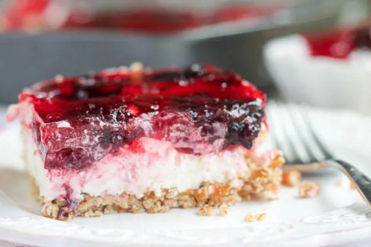 raspberry pretzel cake on a plate