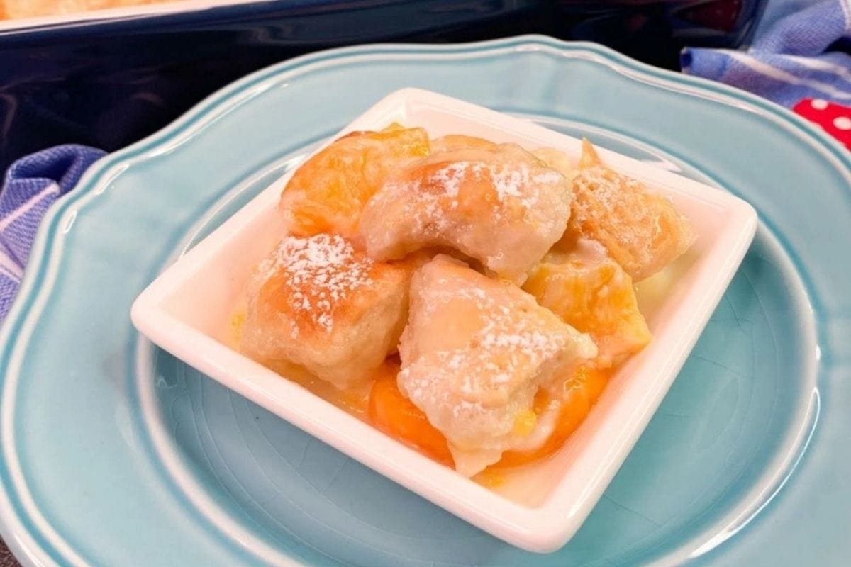 peach cobbler rolls on a blue plate