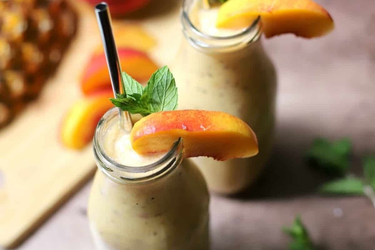 two jars of peach pineapple smoothie