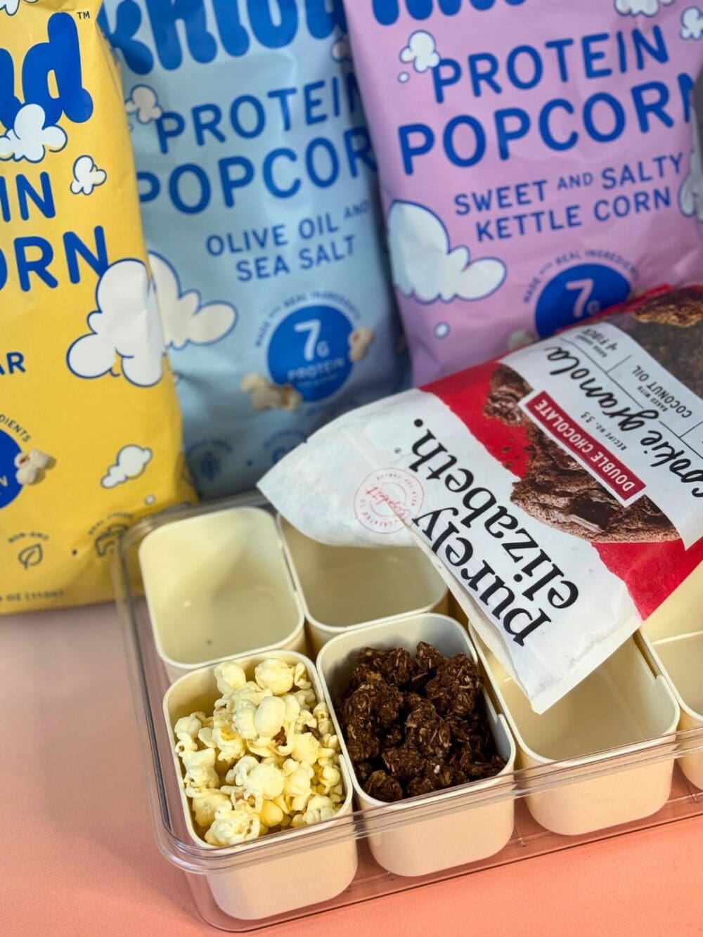 popcorn and granola in a snacklebox