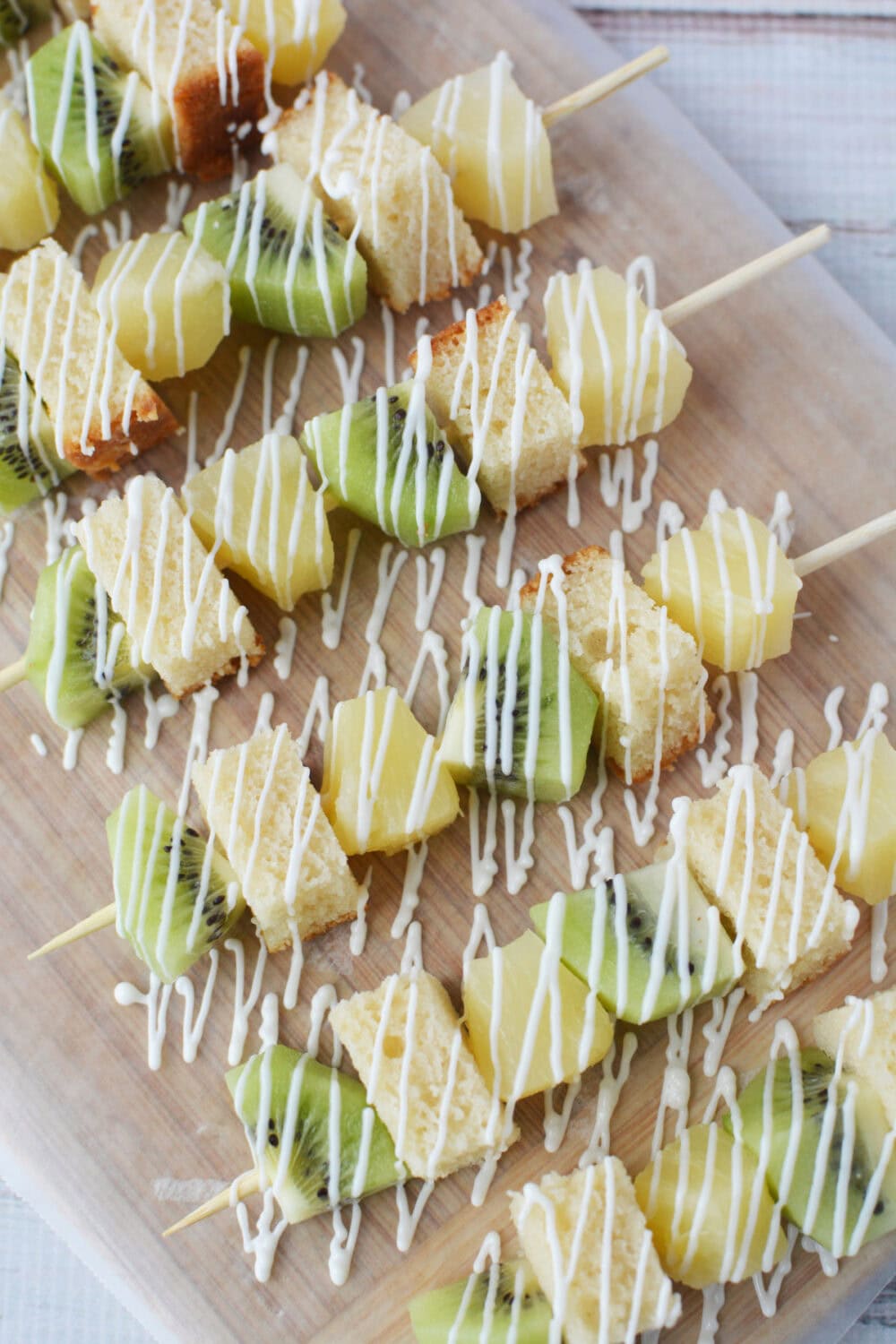 white chocolate drizzled on fruit skewers