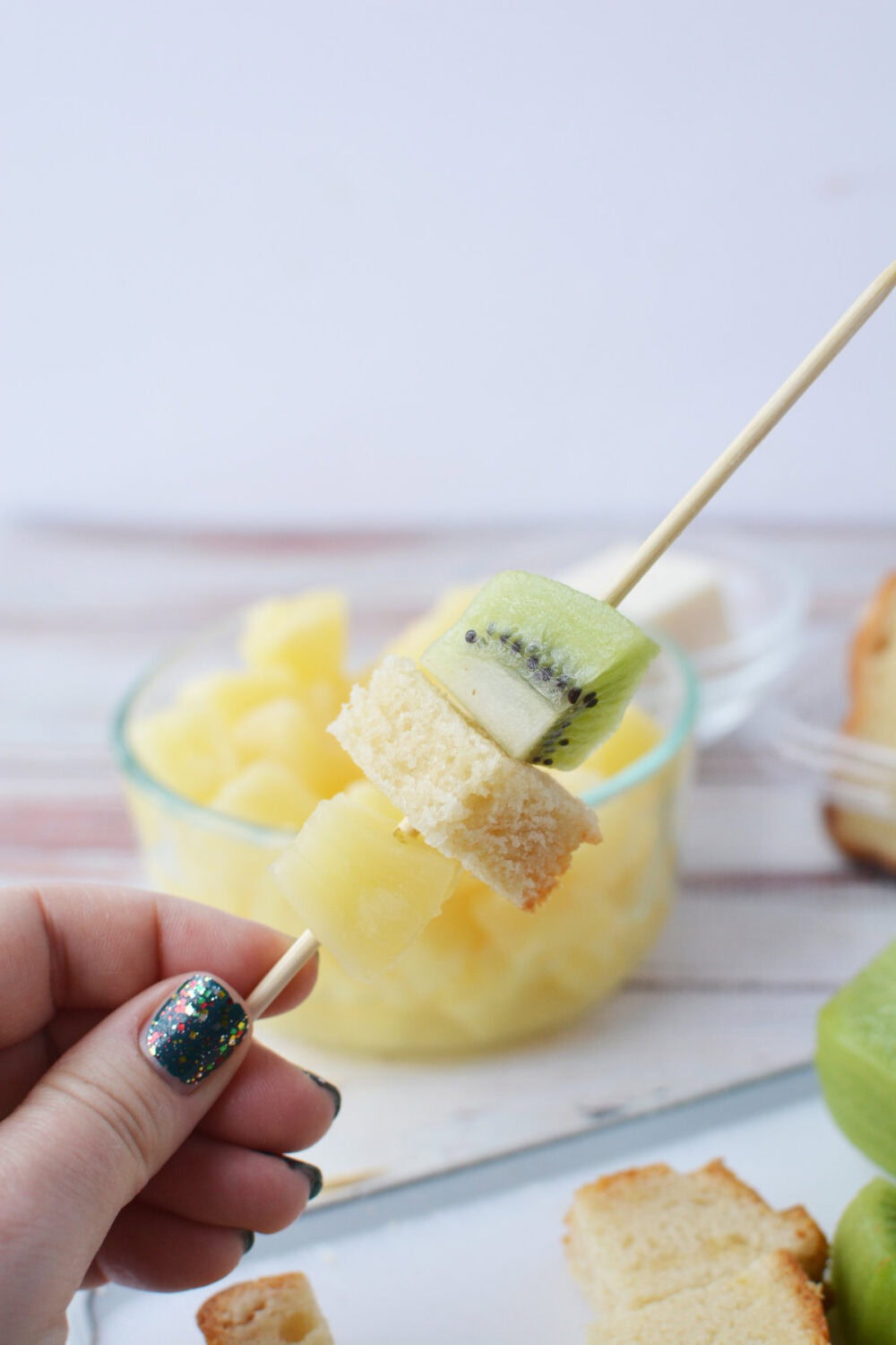 pineapple, pound cake, and kiwi chunks on a skewer