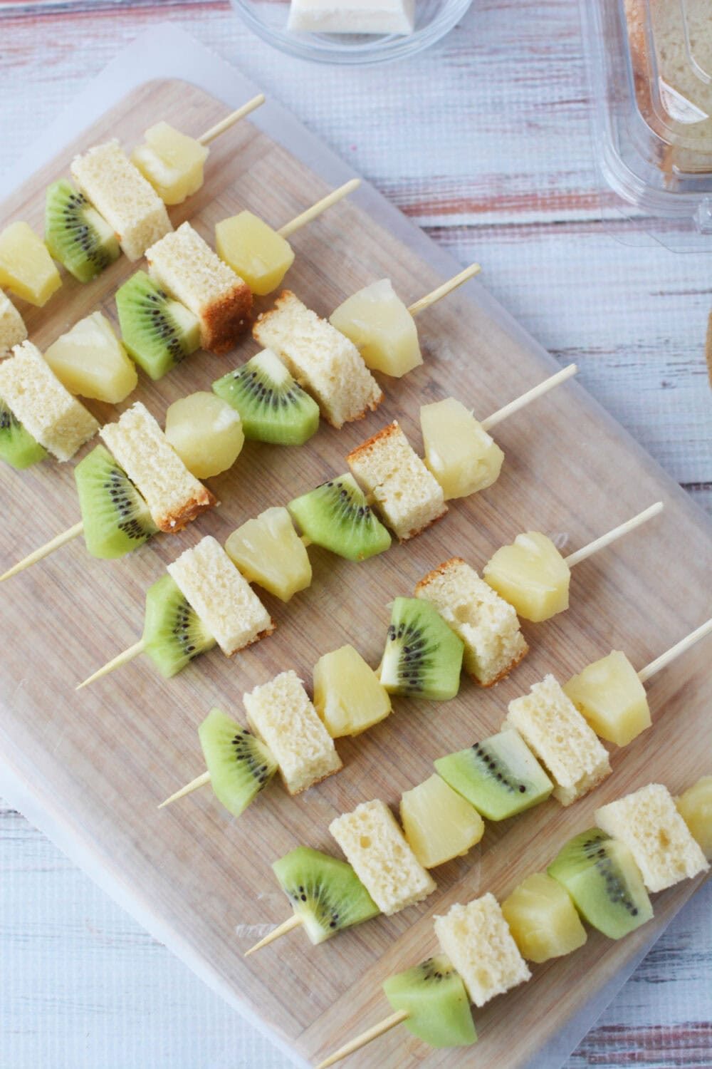 finished tropical skewers lined up on a board