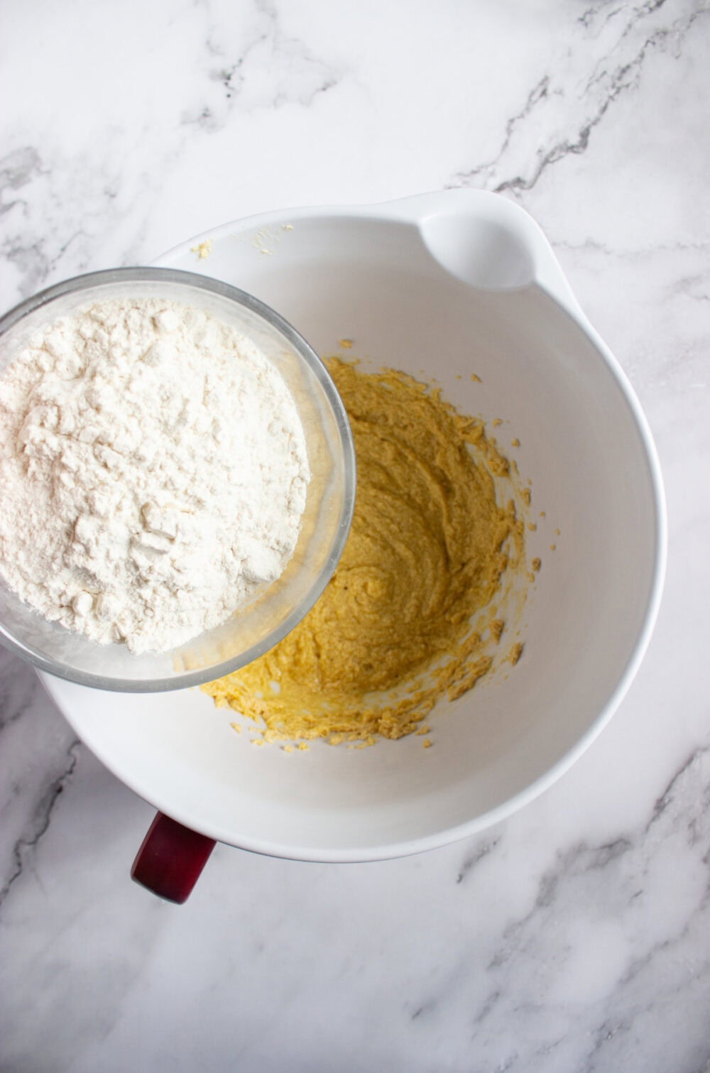 flour going into cookie dough mixture