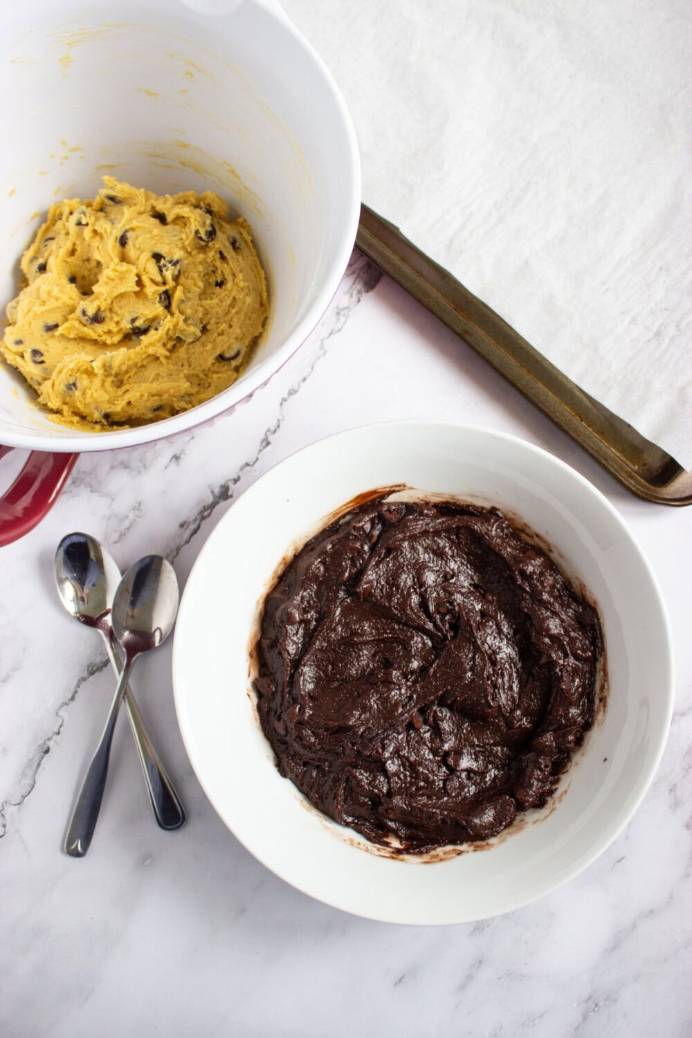 bowls of cookie dough and brownie batter