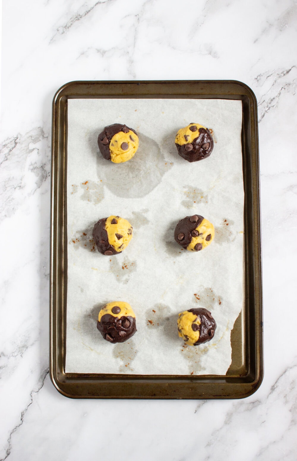 chocolate chip cookie brownie mashup on a baking sheet