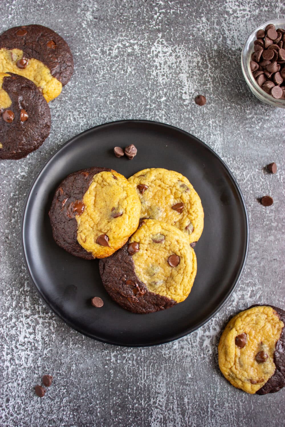 Brownie and chocolate chip cookies half and half on a plate