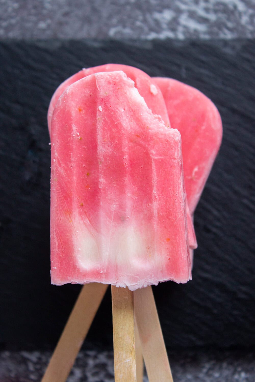 strawberry pops with a bite missing