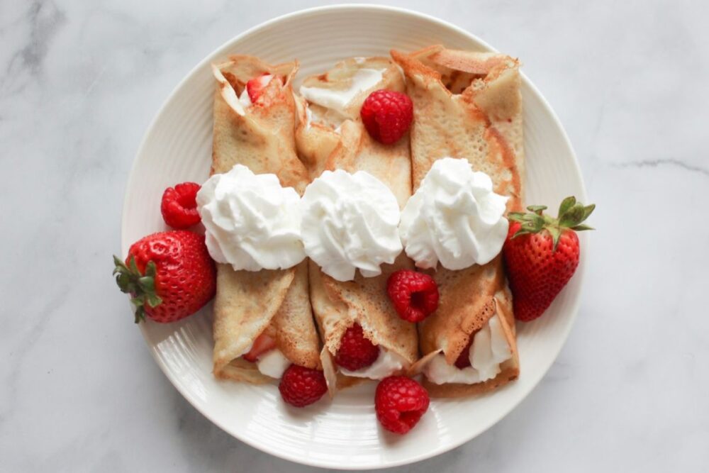 crepes with berries and whipped cream