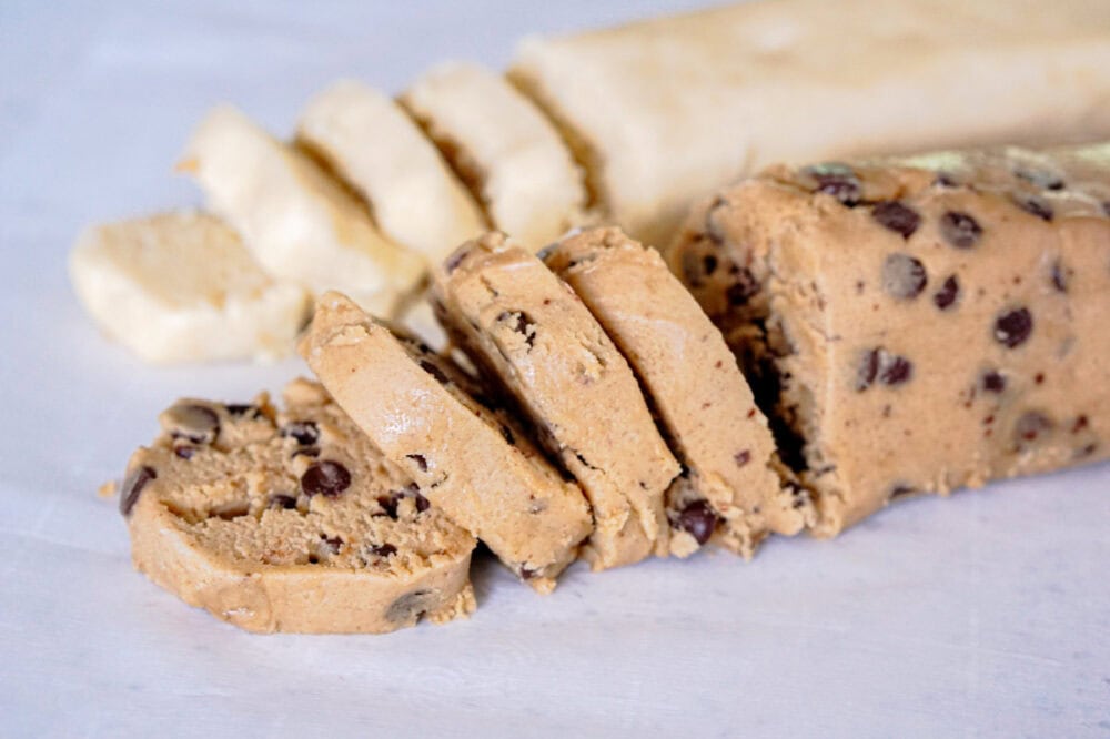 sliced chocolate chip and sugar cookie dough rolls